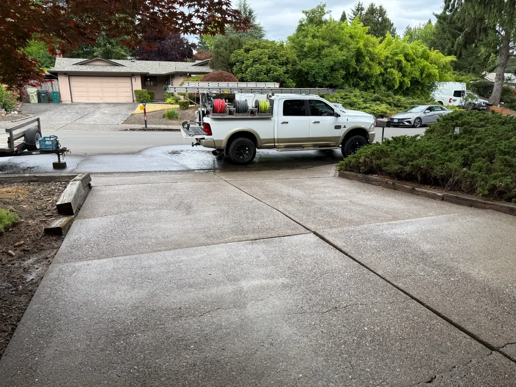 Cleaned driveway near Beaverton and Aloha after pressure washing with Suds Doctor truck at the street
