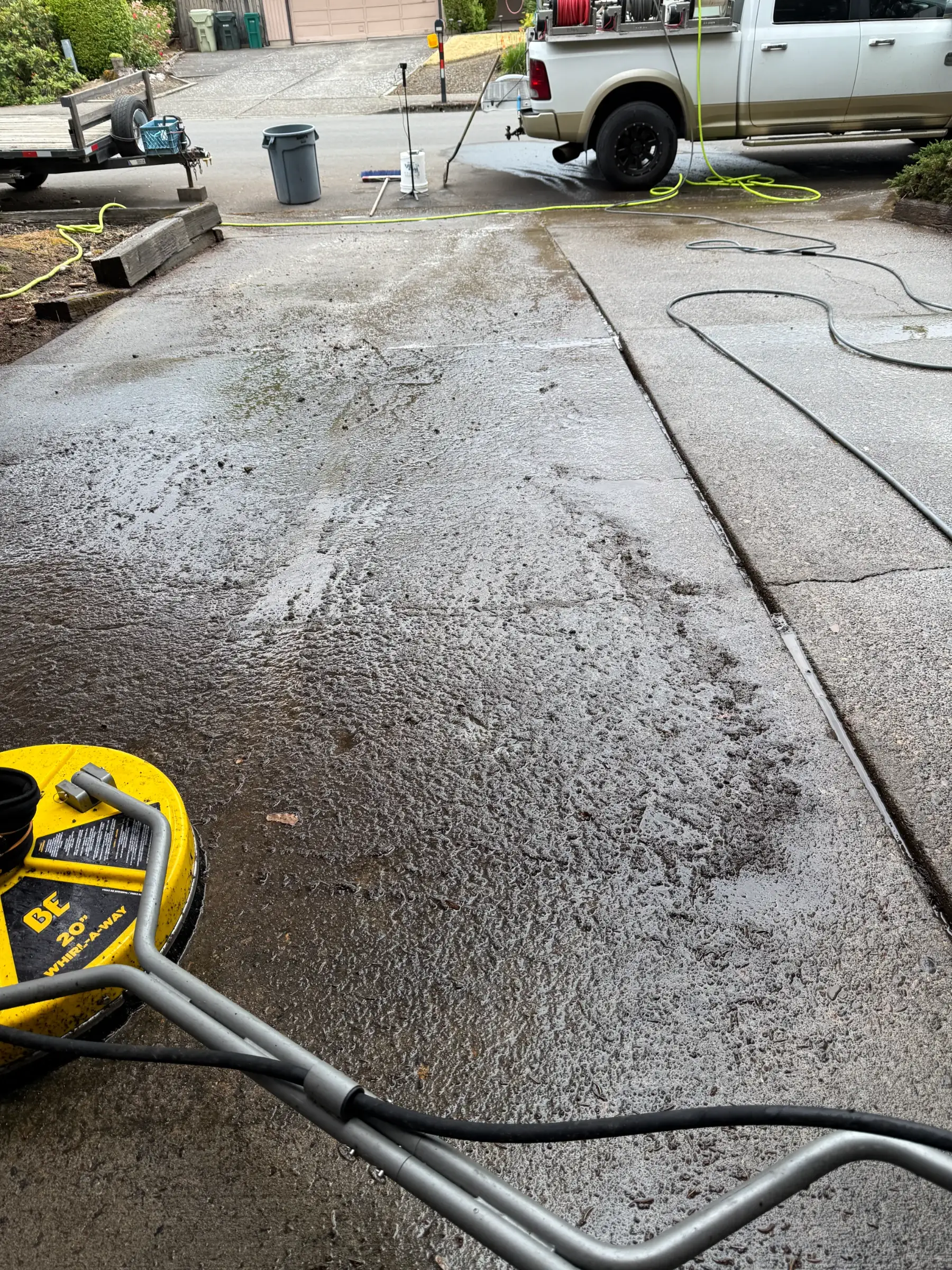 Surface cleaner and pretreatment foam during a Beaverton driveway pressure washing project