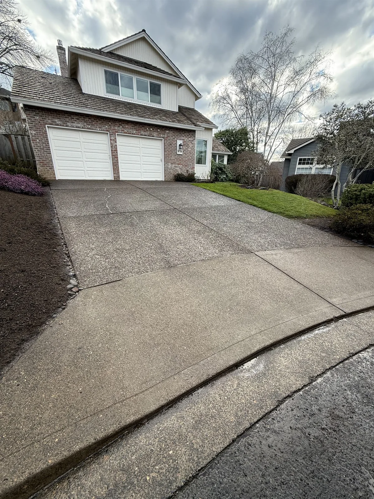 Clean exposed-aggregate driveway after a Beaverton Five Oaks project