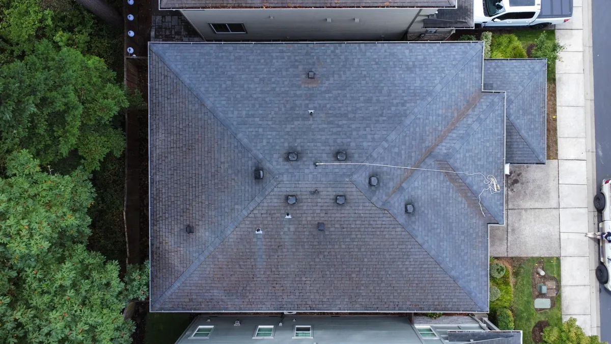 Overhead view of Beaverton asphalt shingle roof after moss and pine-needle cleaning