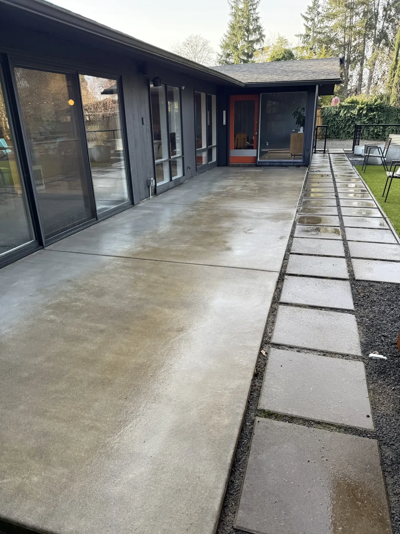Cleaned back patio concrete and square slabs at a Cedar Mill home