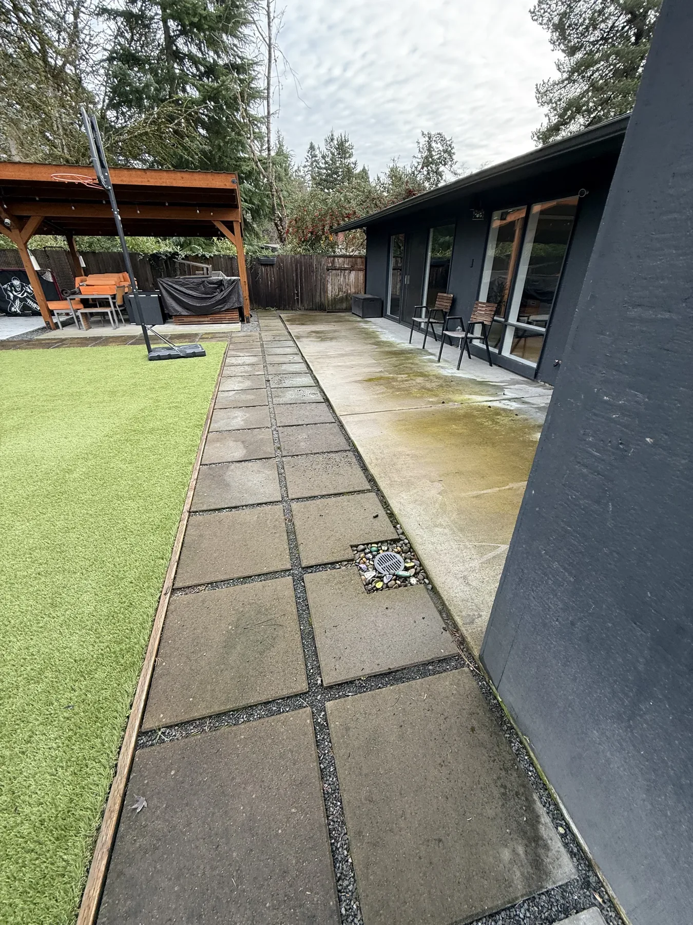 Long back patio and side yard concrete at a Cedar Mill pressure washing project