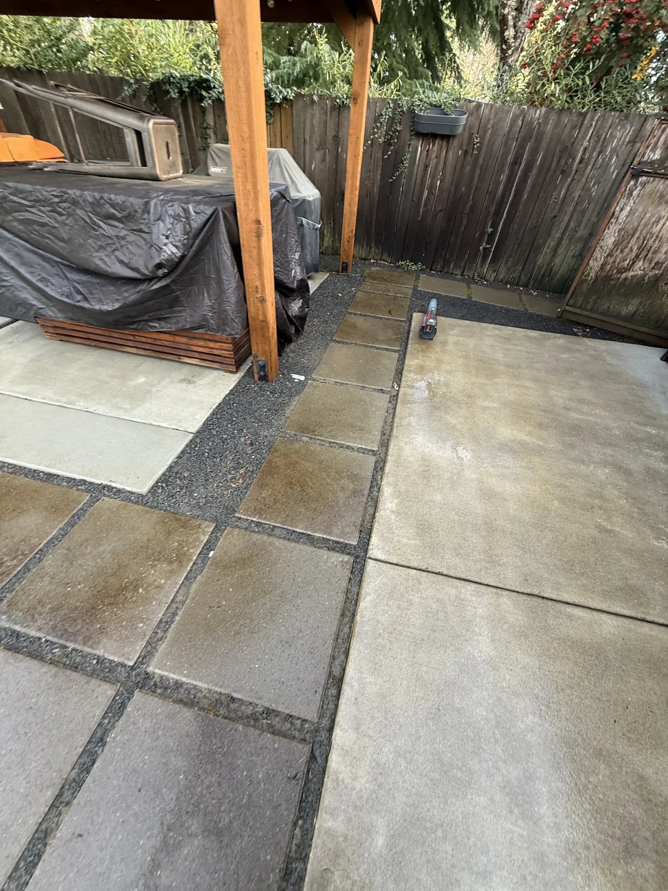 Cleaned covered patio concrete at a Cedar Mill home after pressure washing