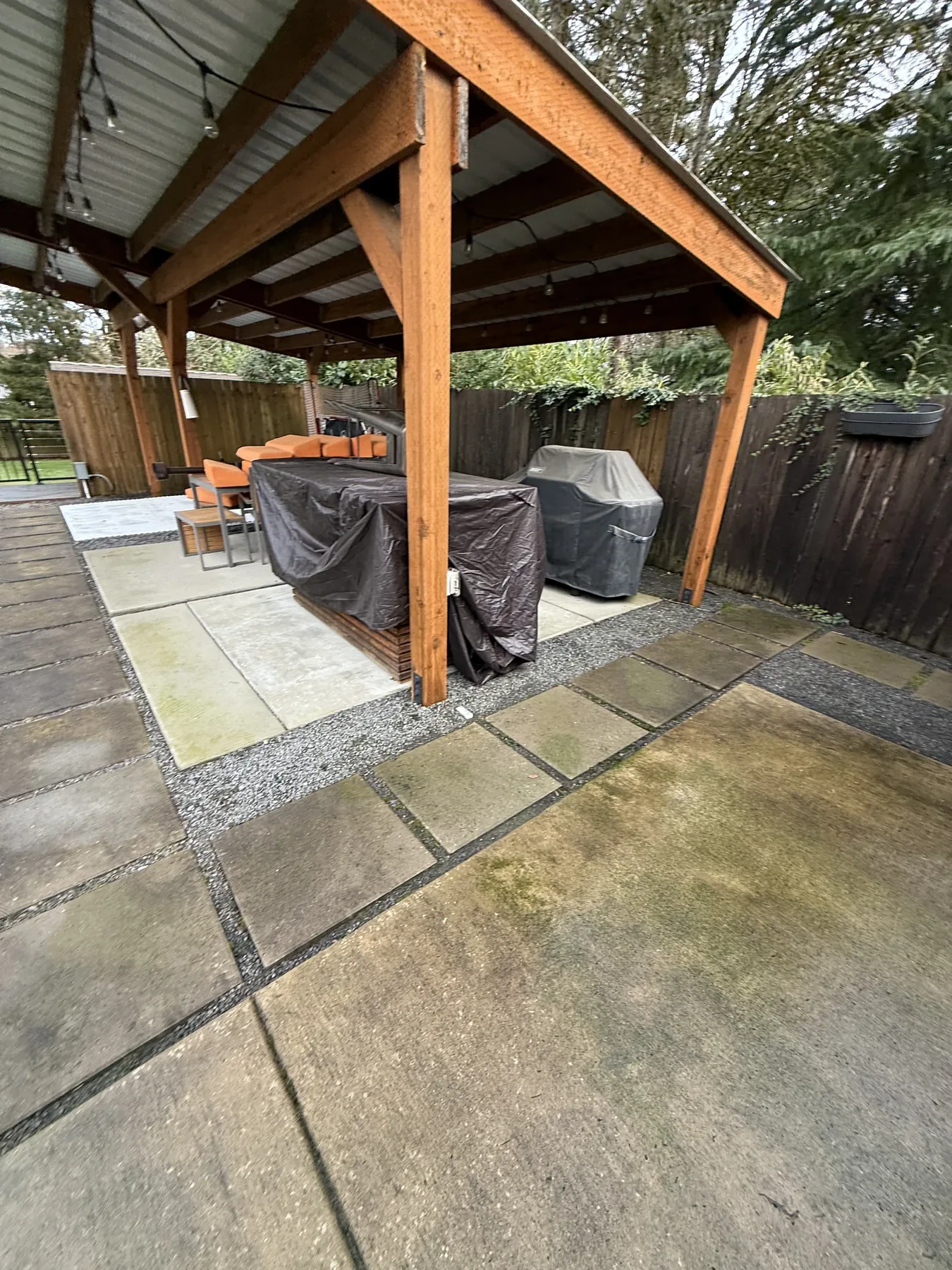 Covered patio concrete and slab transition during a Cedar Mill patio cleaning project