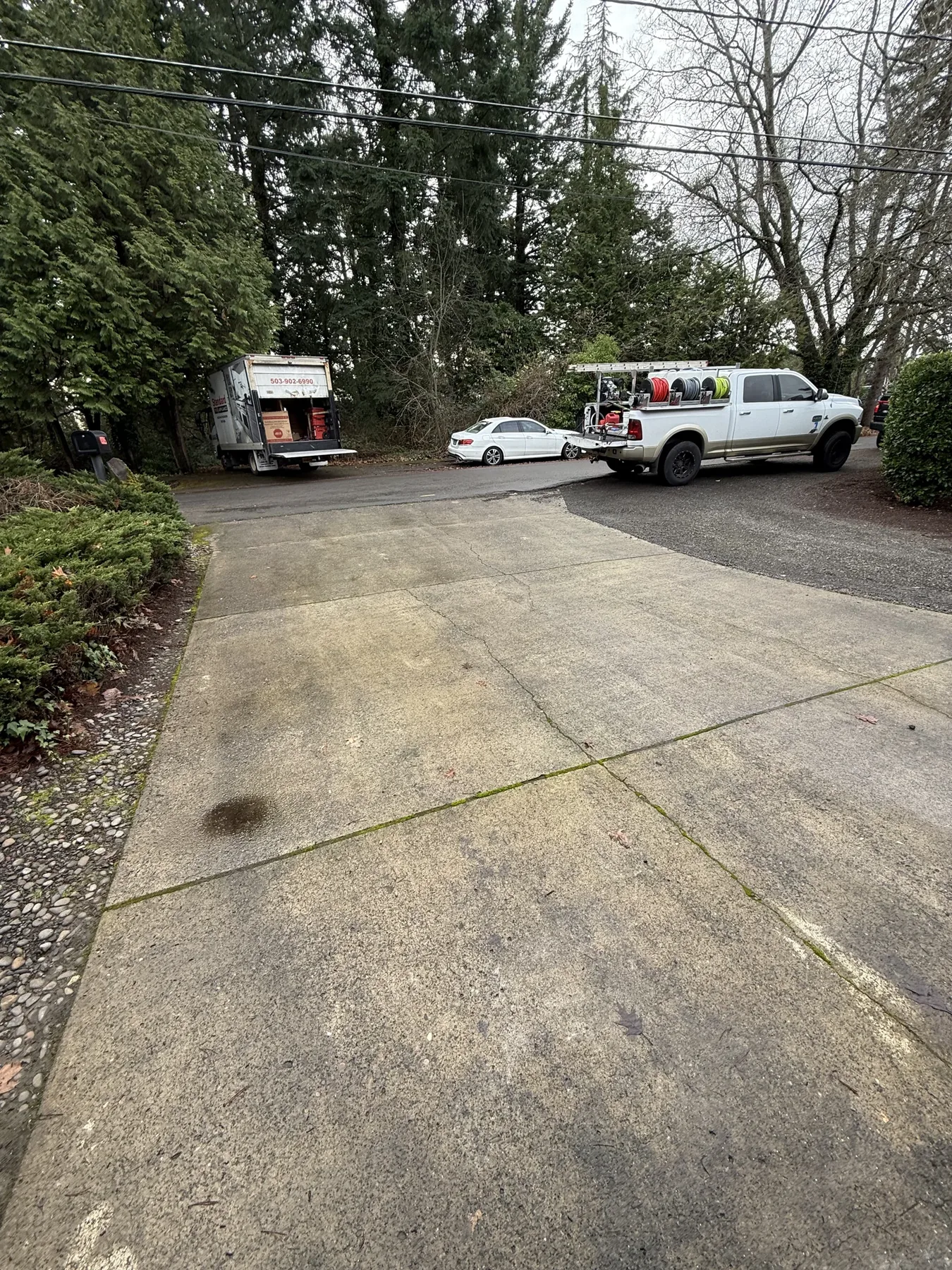 Cedar Mill driveway cleaning jobsite with Suds Doctor truck and hoses
