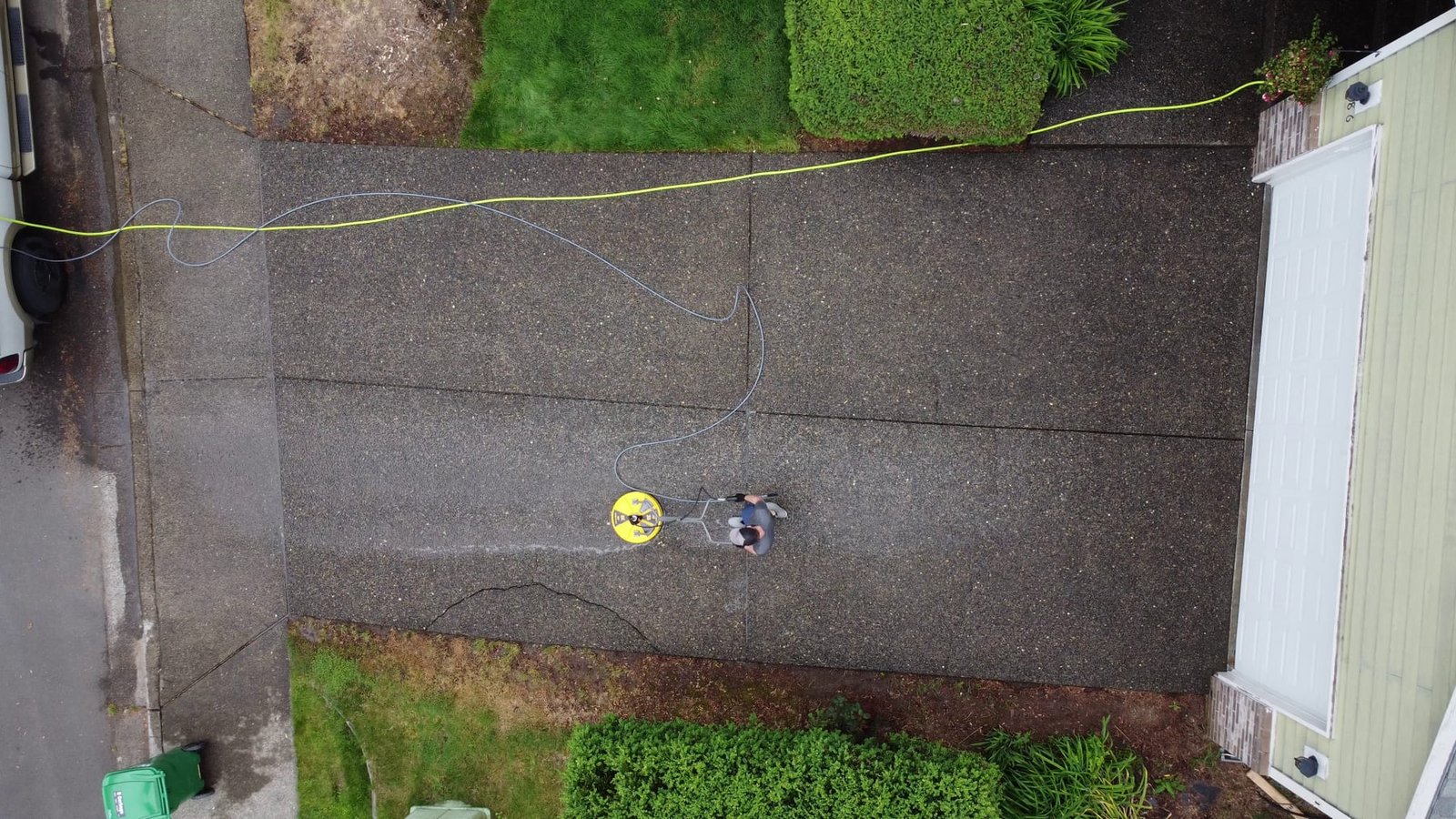 Suds Doctor cleaning a driveway before a home sale