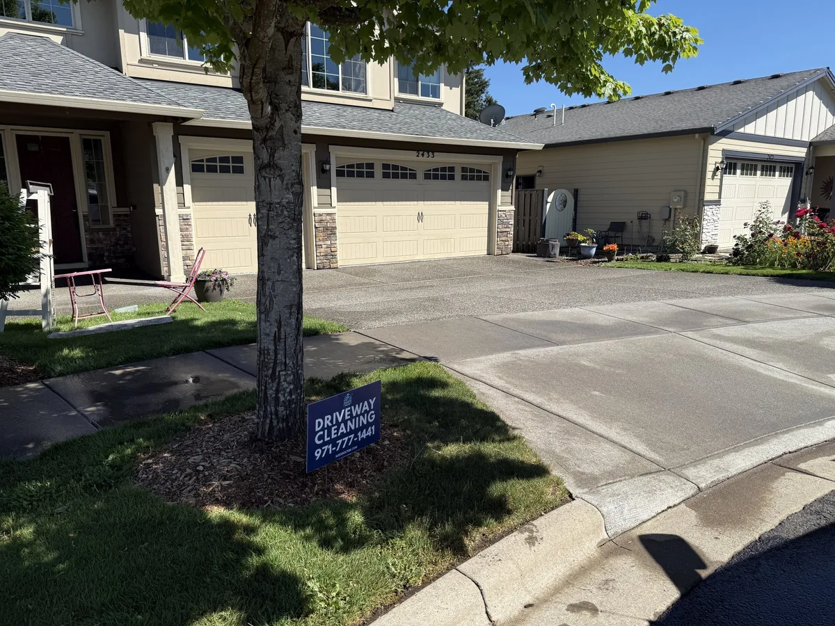 Finished Forest Grove driveway cleaning project with Suds Doctor yard sign