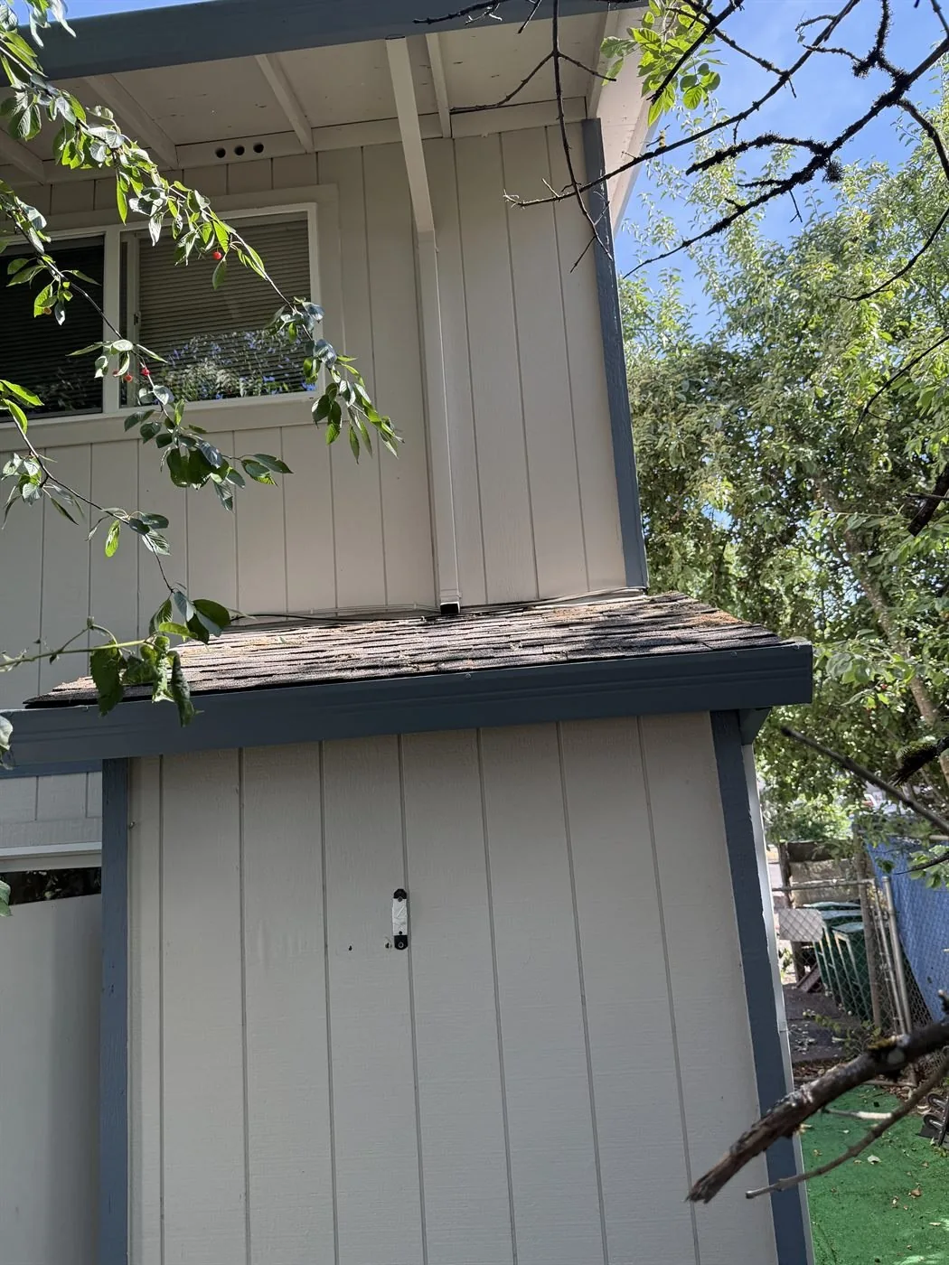 Clean siding after soft washing a Forest Grove fourplex