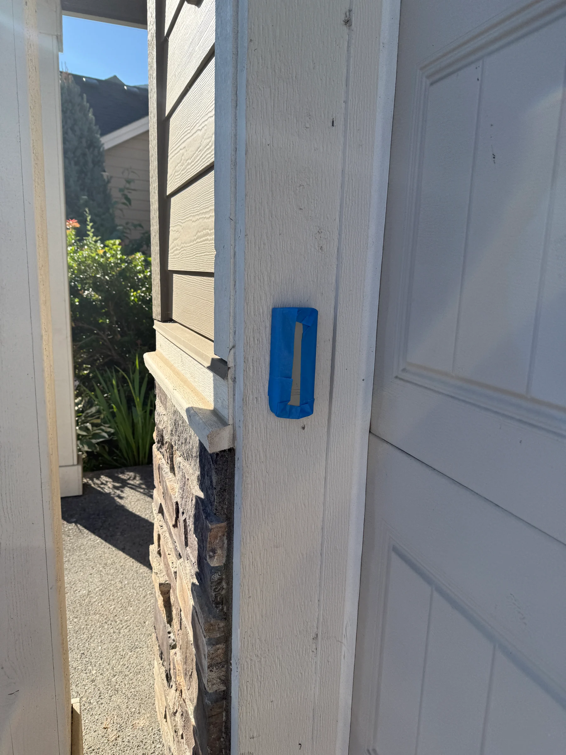 Front door hardware protected during Forest Grove house washing