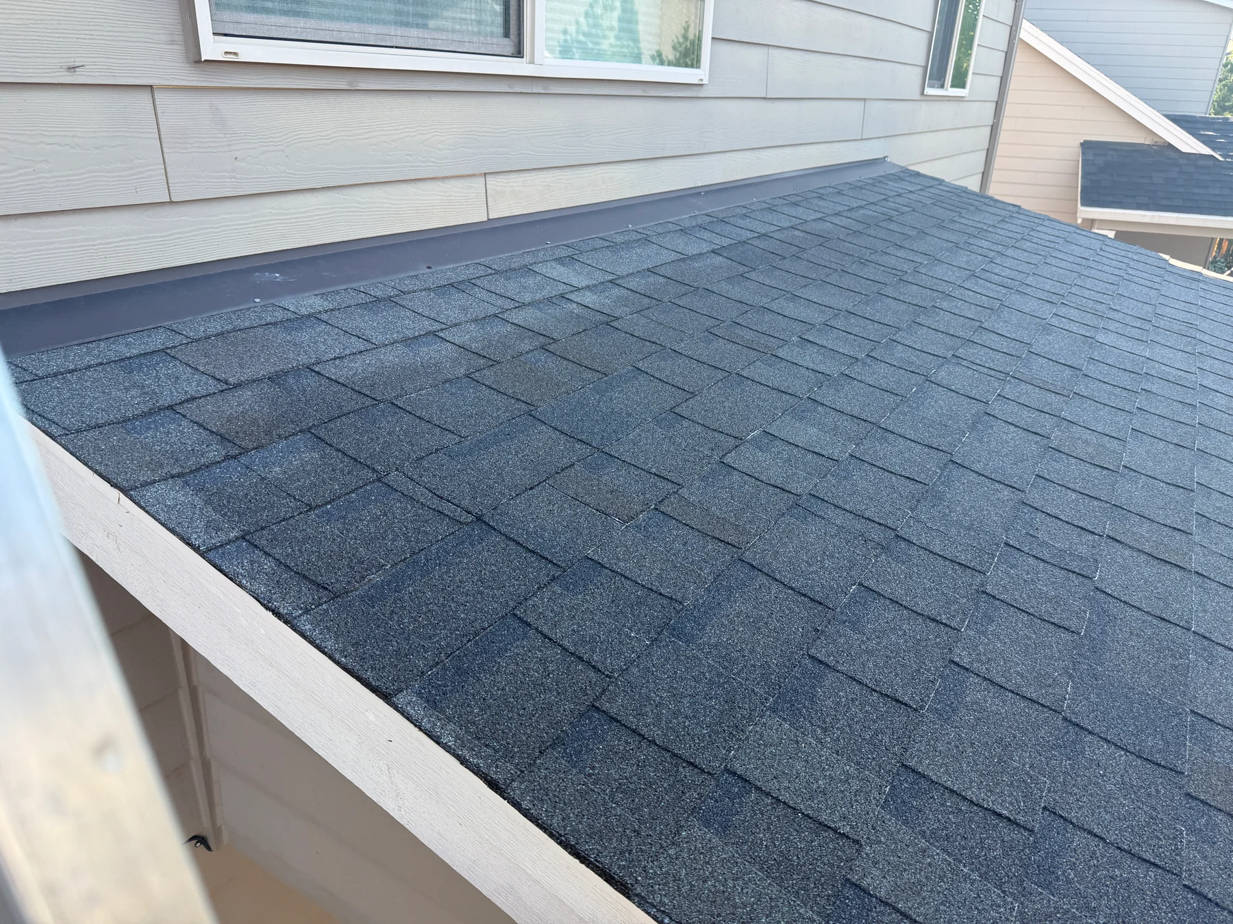 Finished treated asphalt shingle roof in Forest Grove