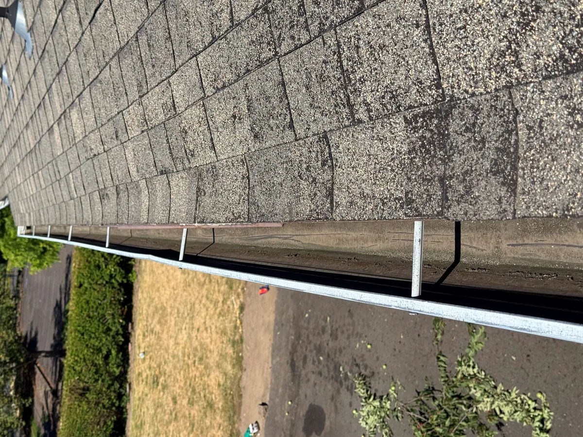 Cleaned gutter after debris removal on a Beaverton Oregon roof