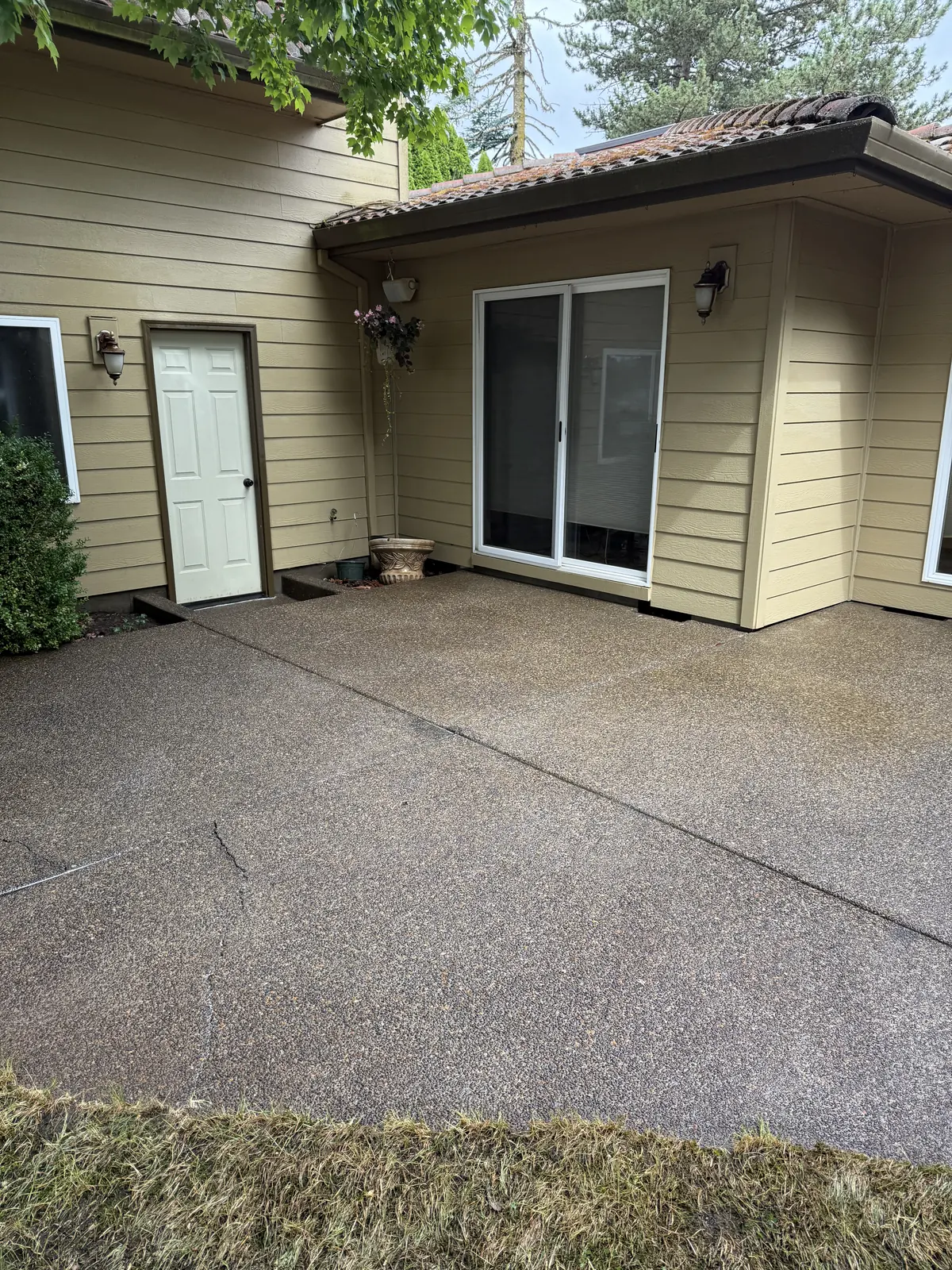 Clean concrete patio after pressure washing at a Hillsboro Oregon home
