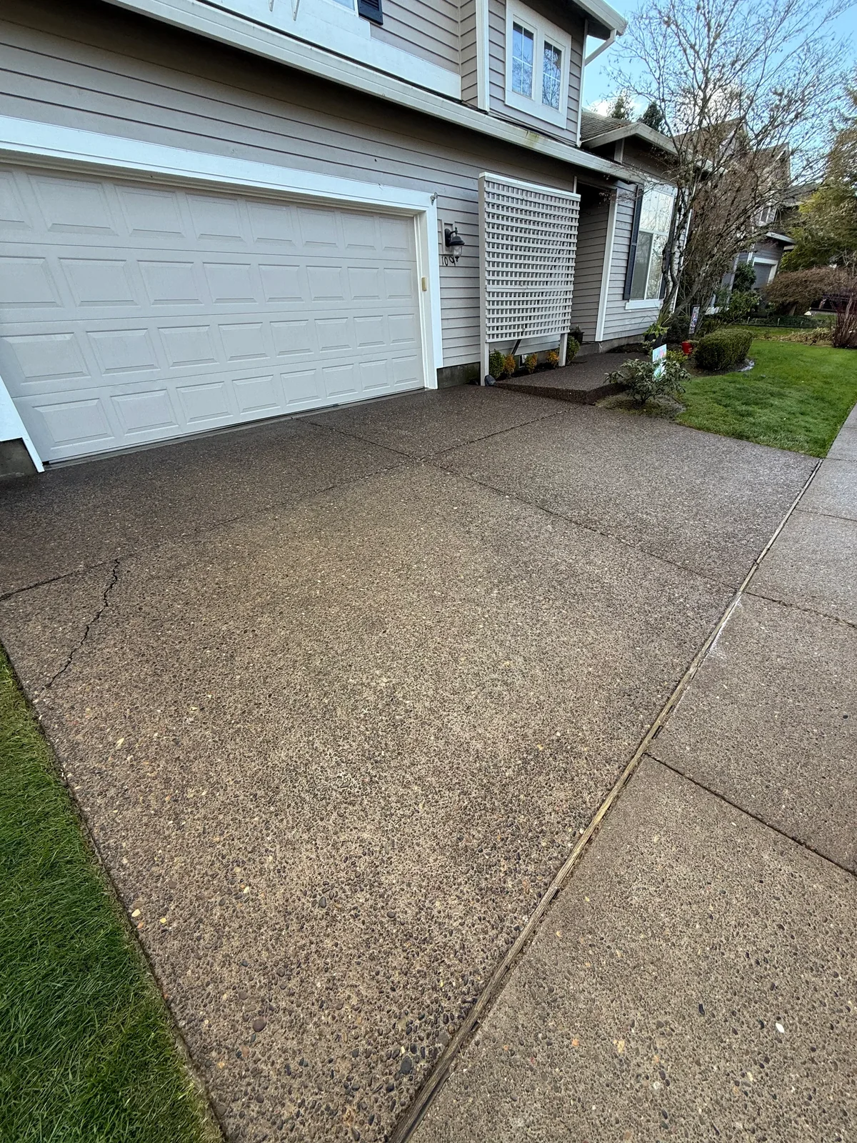 Hillsboro driveway after pressure washing beside the garage