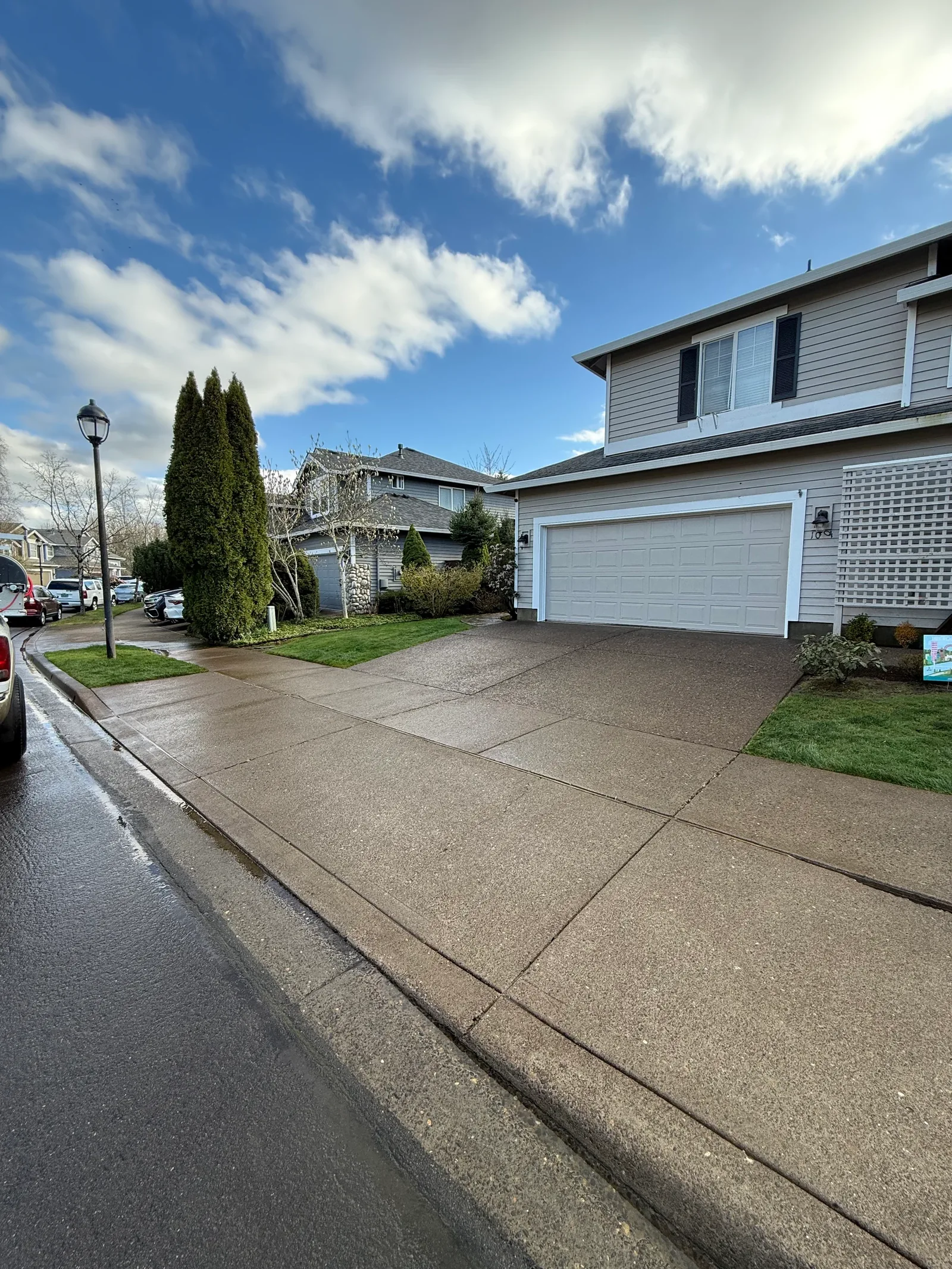 Clean driveway and sidewalk after pressure washing at a Hillsboro HOA home near Jones Farm