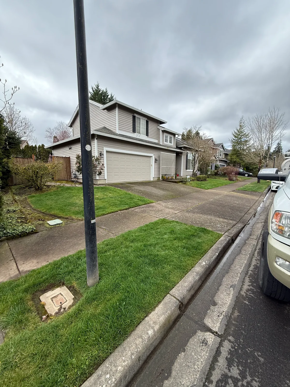 HOA sidewalk and driveway approach before pressure washing in Hillsboro