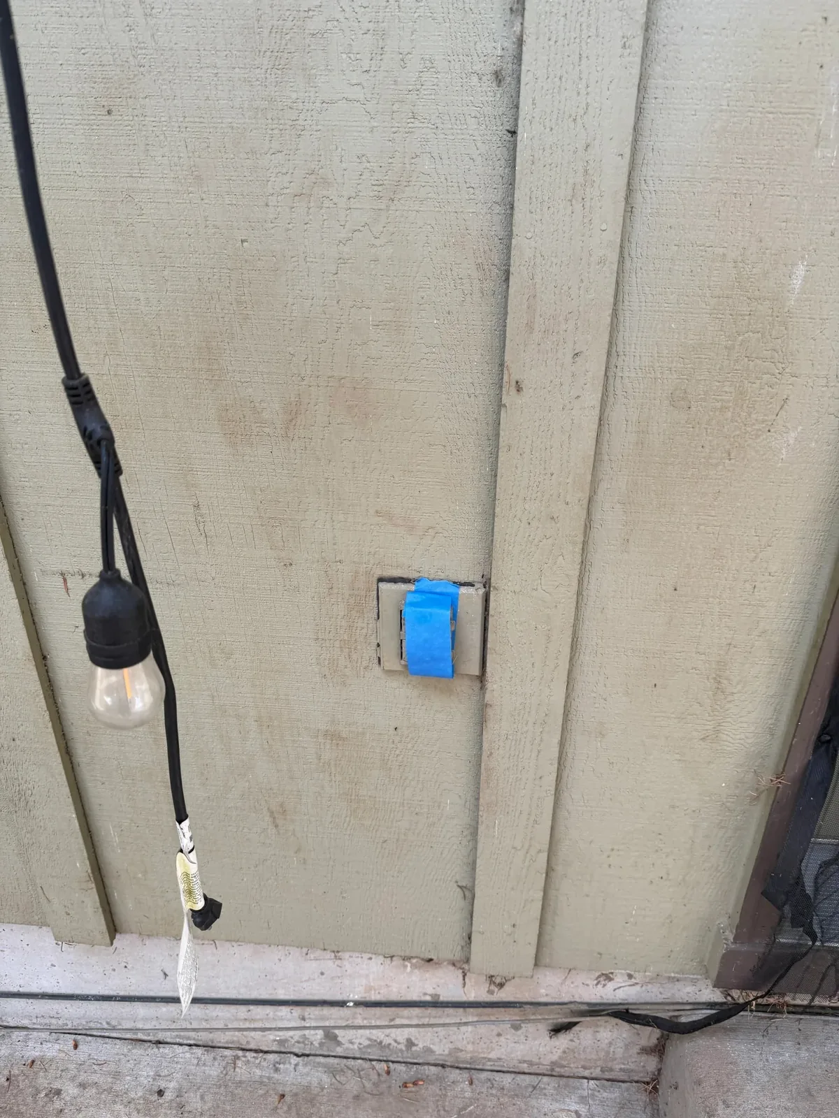 Exterior outlet protected before soft washing multifamily siding in Hillsboro