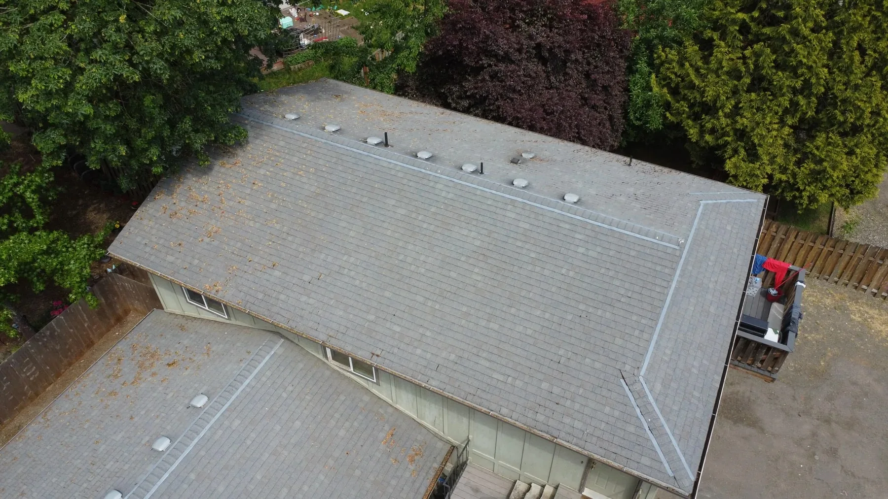 Finished aerial view of a Hillsboro multifamily roof after moss cleaning and treatment