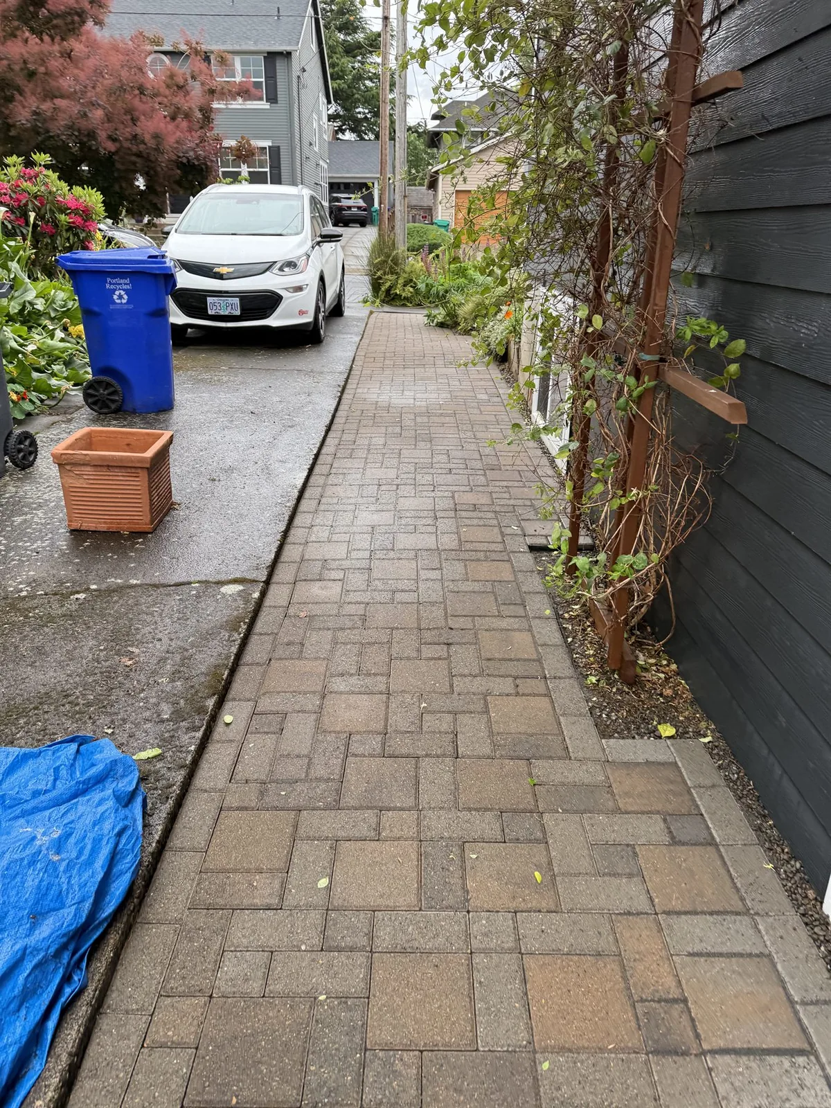 Wide view of cleaned paver walkway and driveway area after pressure washing in Portland Oregon