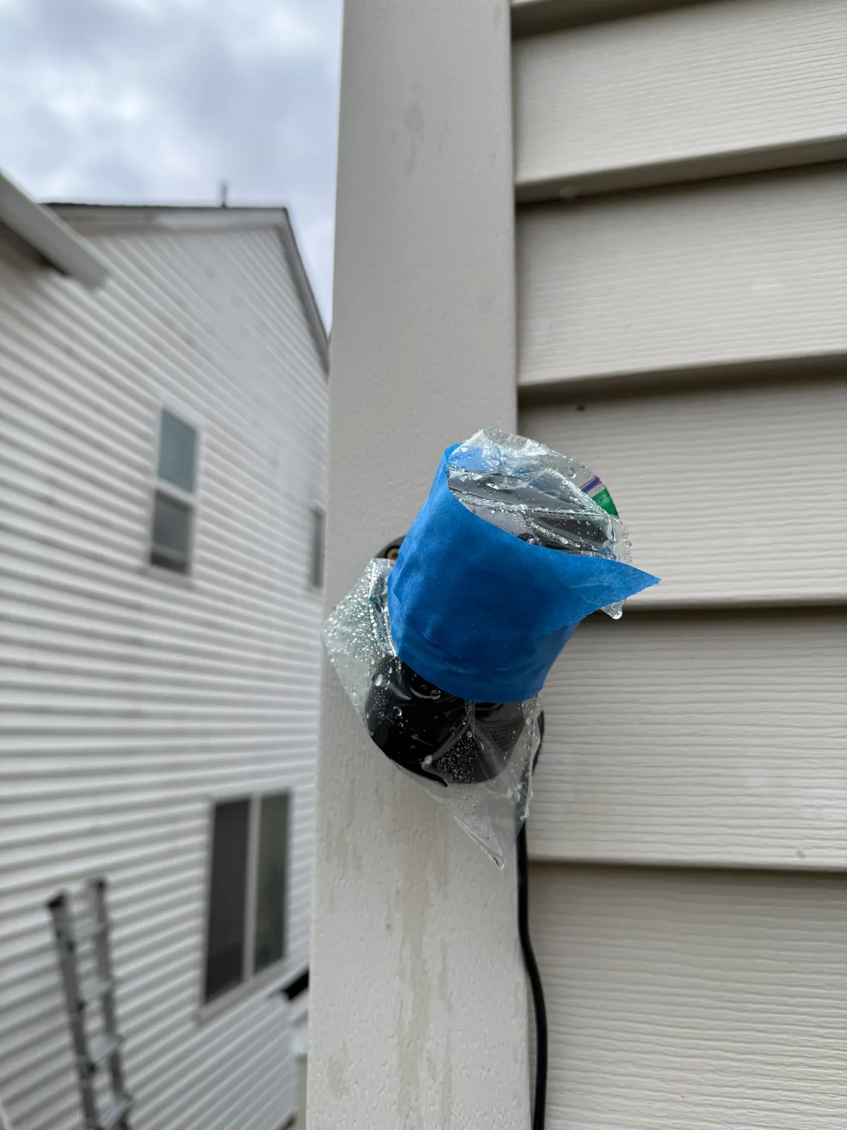 Outdoor camera protected before exterior house washing