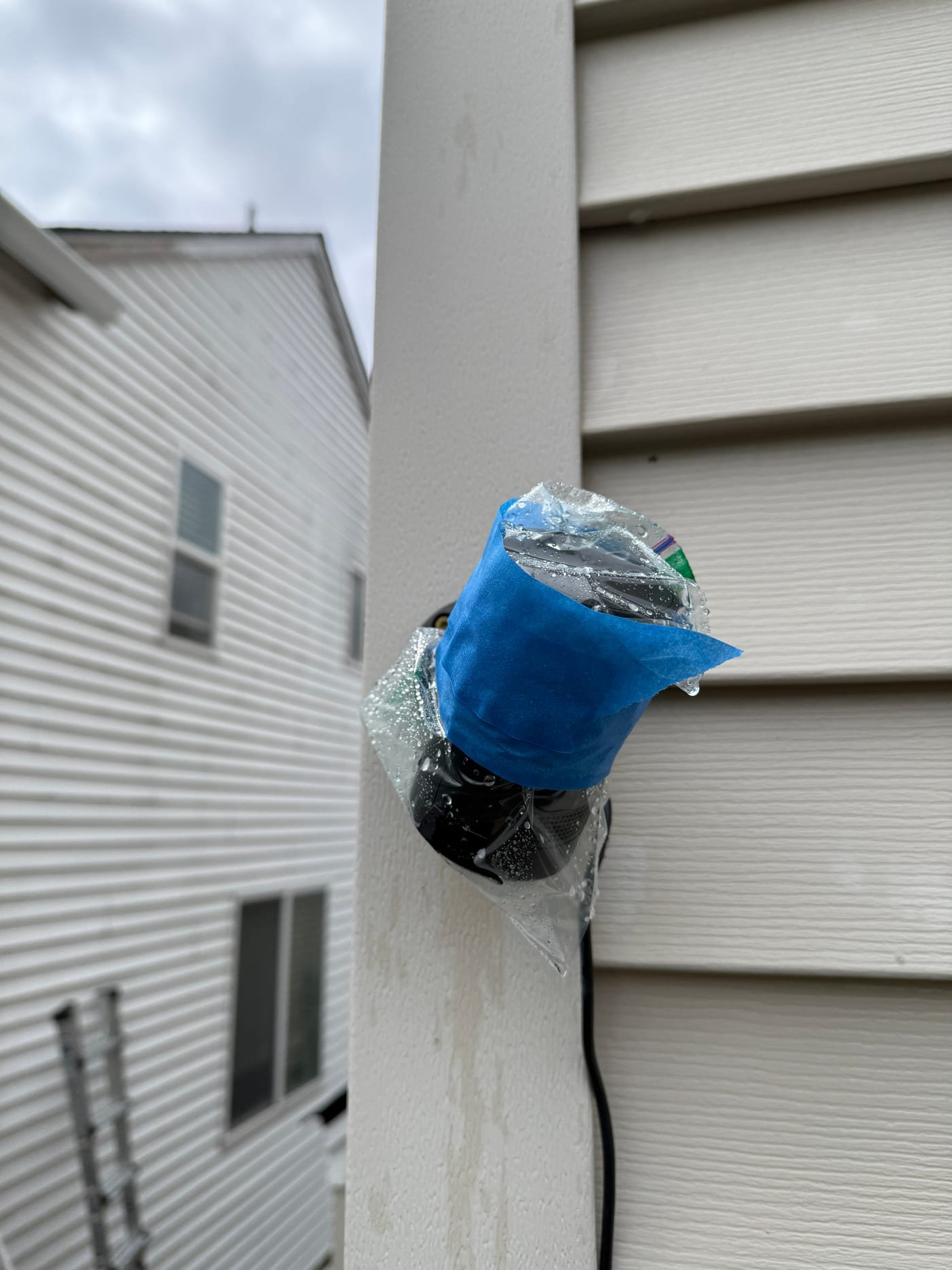 Outdoor camera protected before exterior house washing