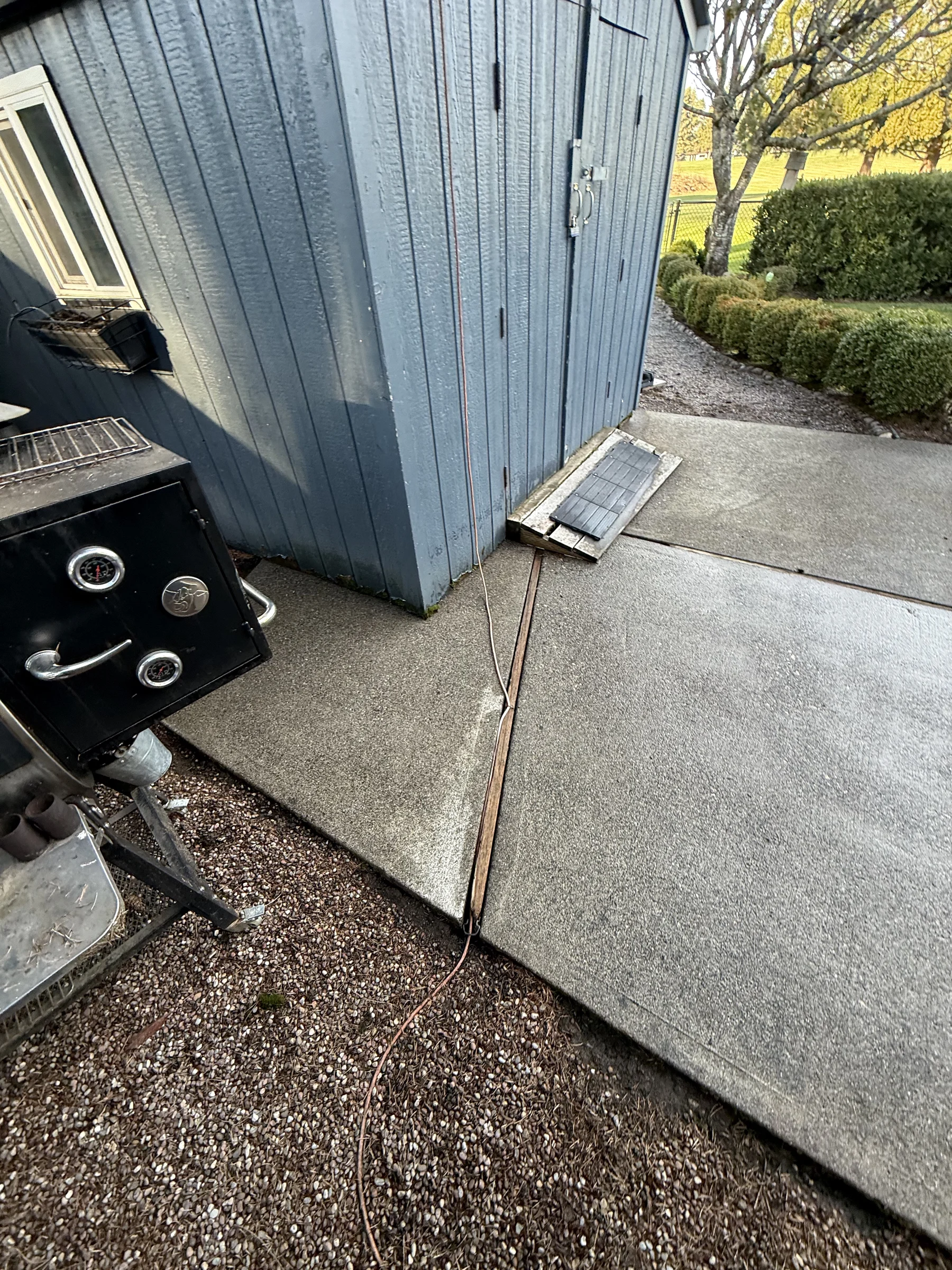 Cleaned back patio concrete pad at a Rock Creek home after pressure washing