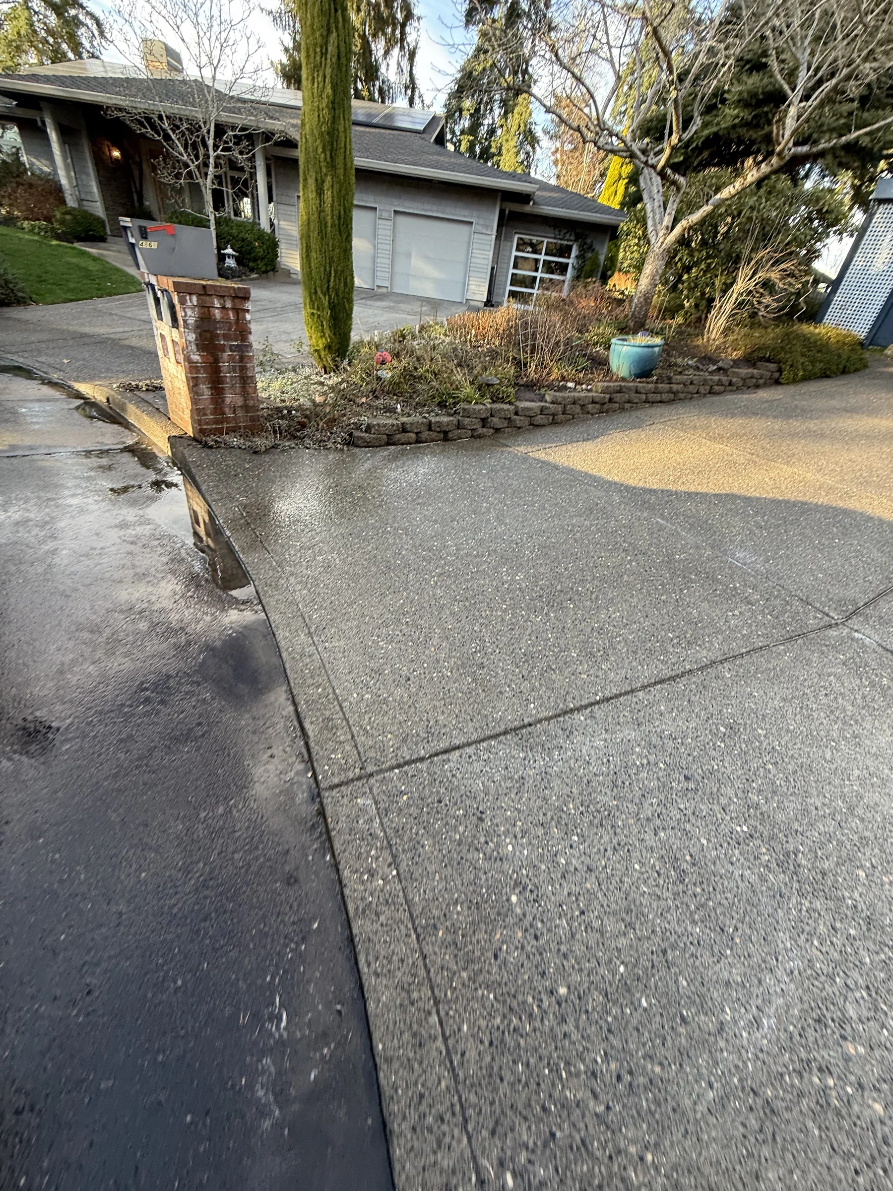 Cleaned driveway entry after pressure washing at a Rock Creek home