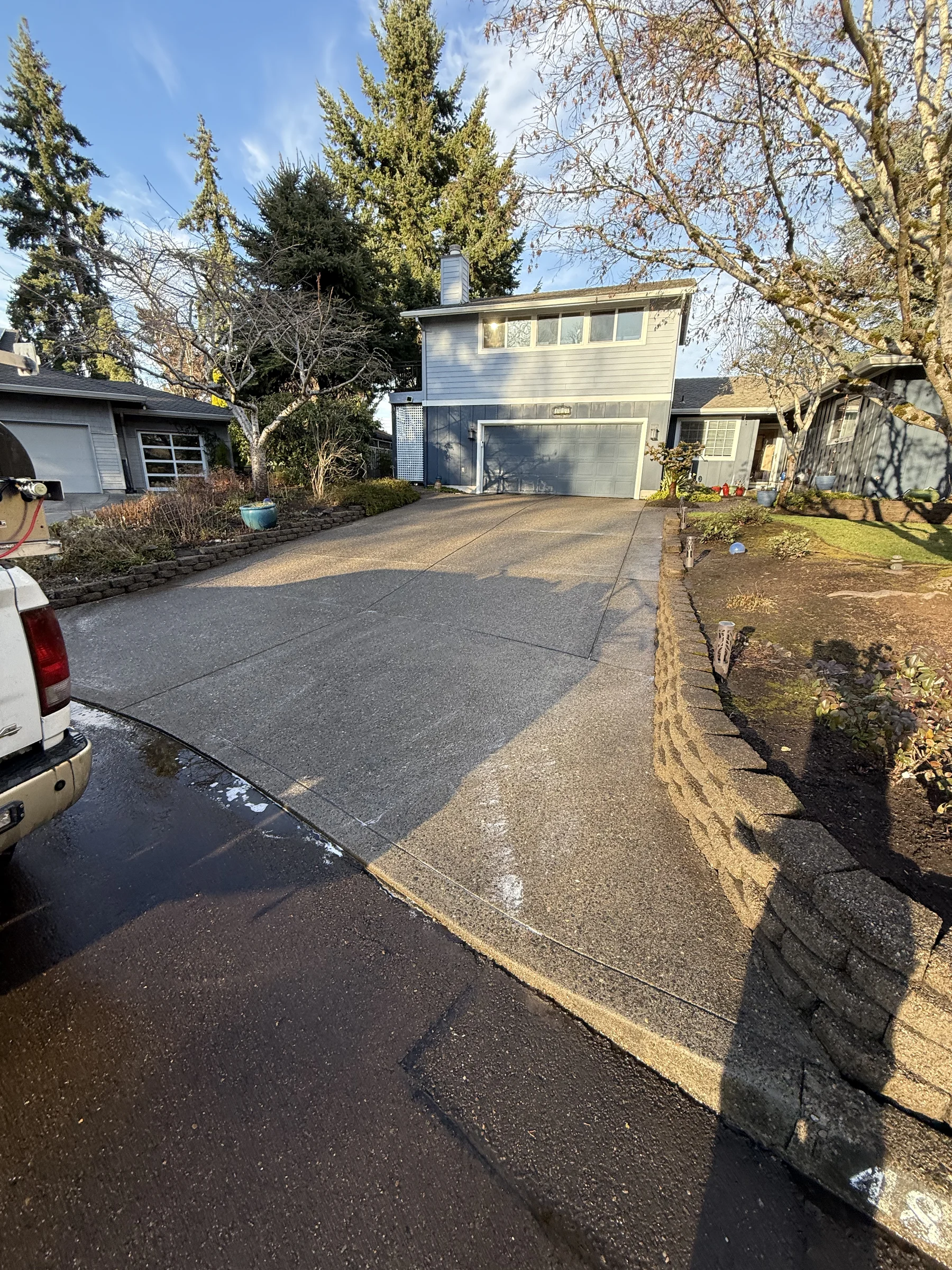 Finished sloped driveway after pressure washing in Rock Creek