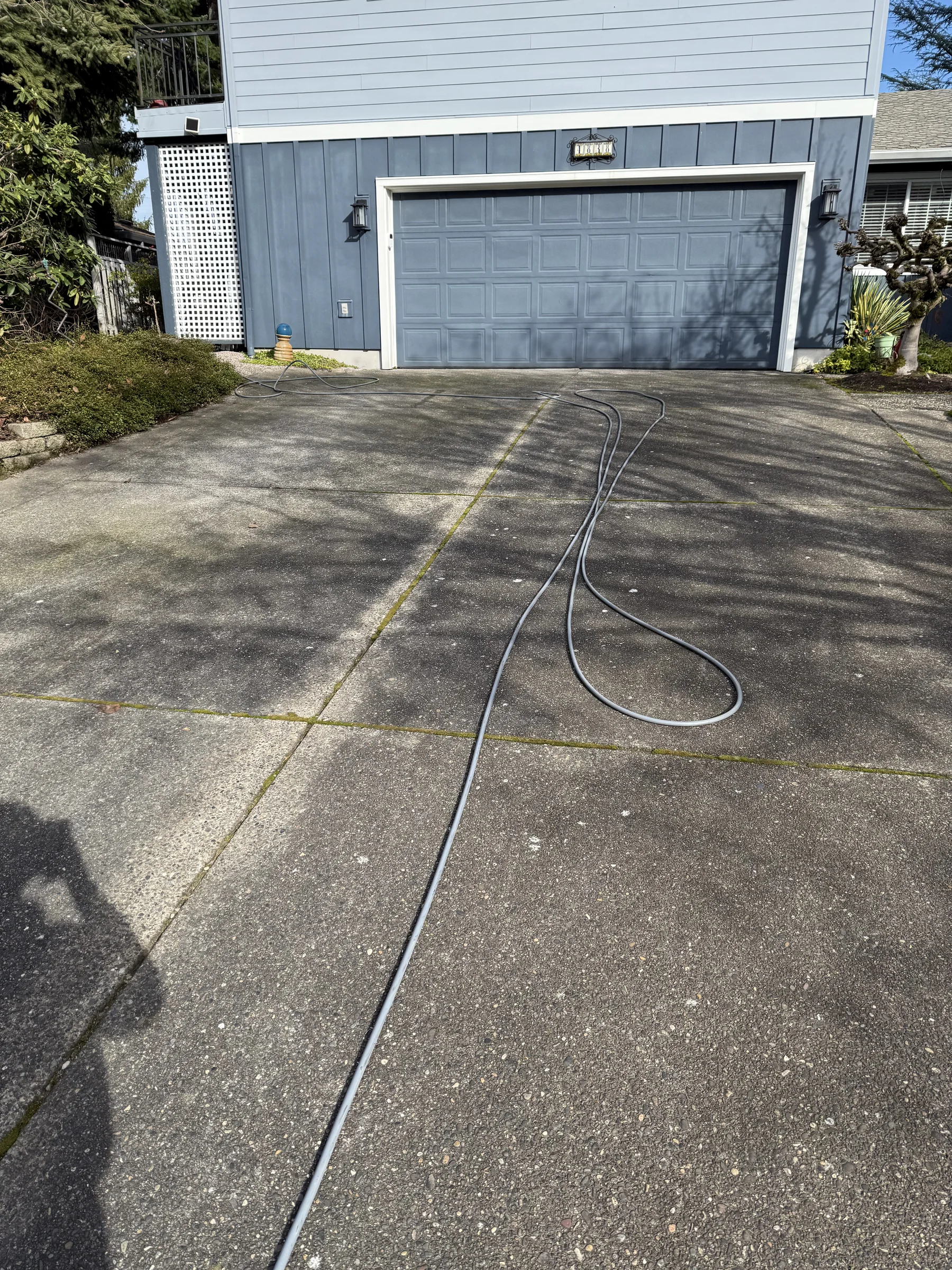 Rock Creek driveway and garage approach before pressure washing
