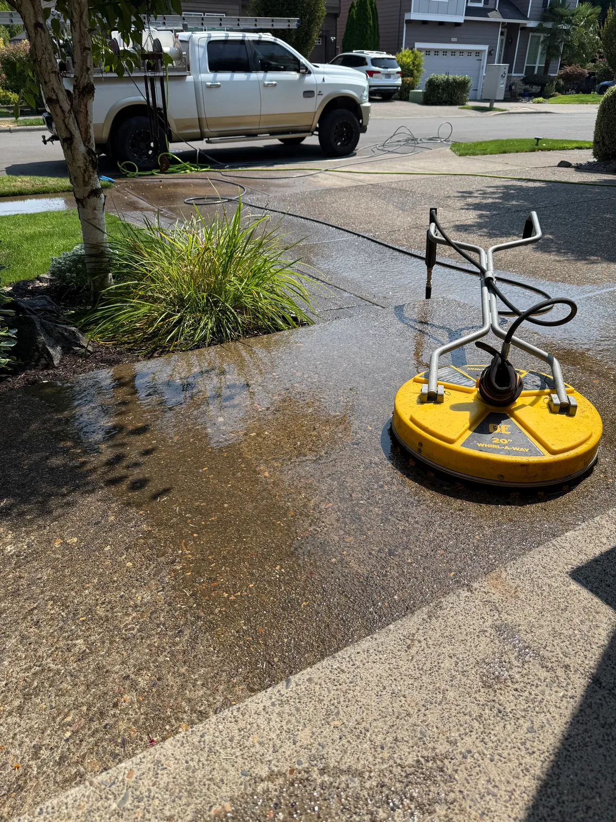 Surface cleaner working across an exposed-aggregate driveway in Sherwood