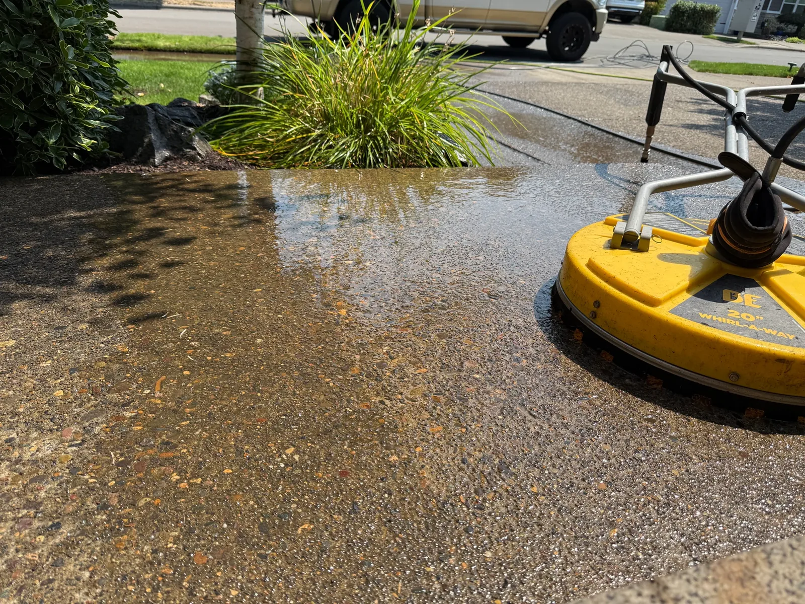 Surface cleaner beside the front entry landscaping at a Sherwood home