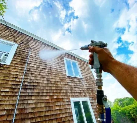 Low pressure soft washing spray used for siding and house washing methods