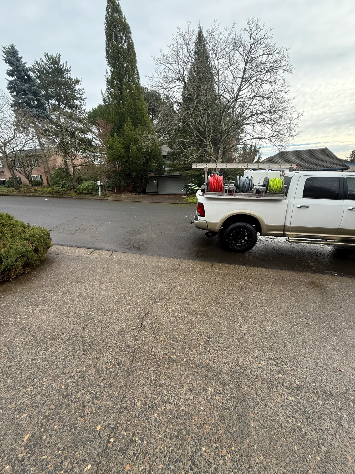 Suds Doctor pressure washing truck parked near a South Beaverton driveway cleaning project