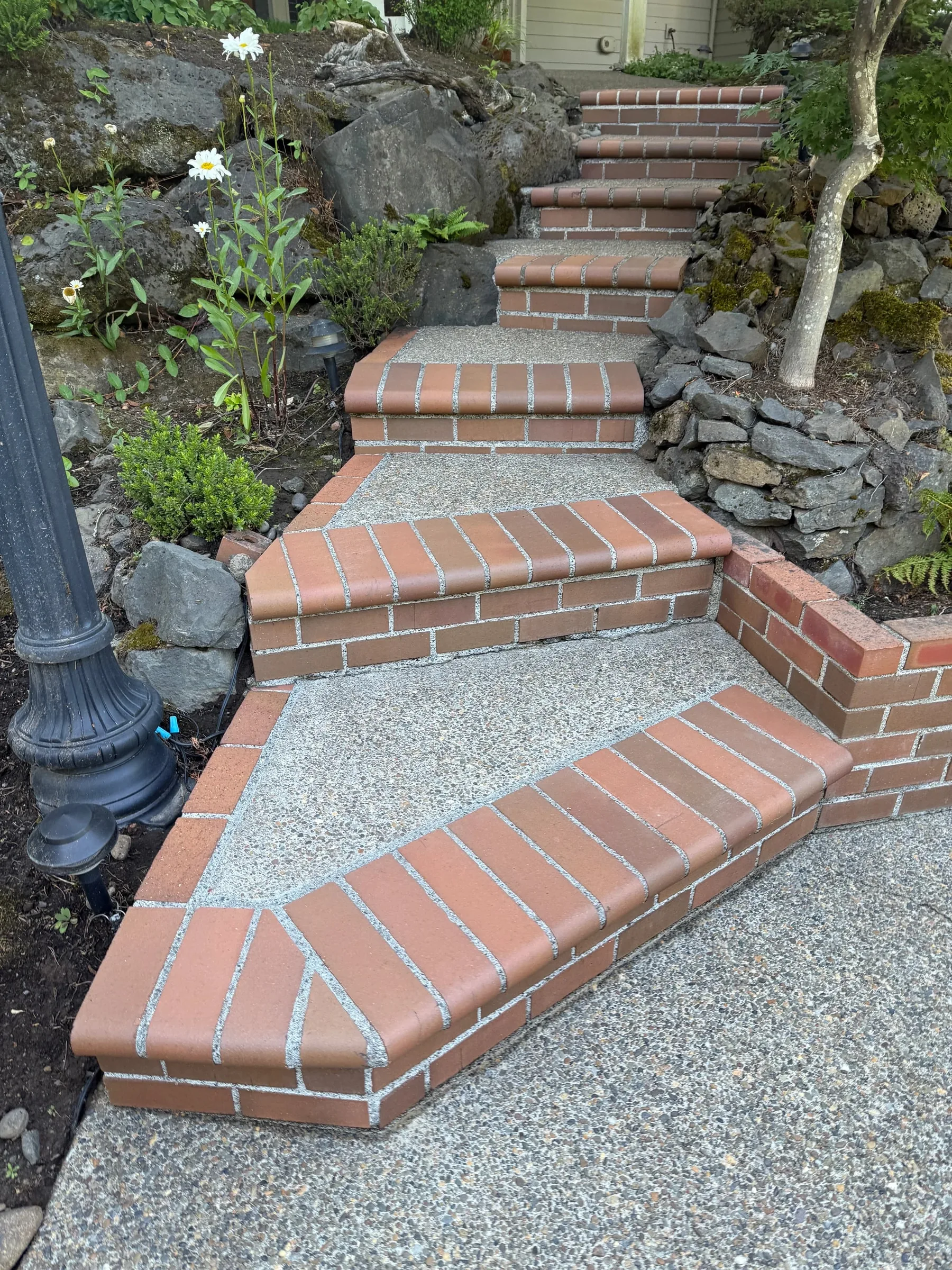 Cleaned brick-trimmed concrete steps in a landscaped West Beaverton backyard