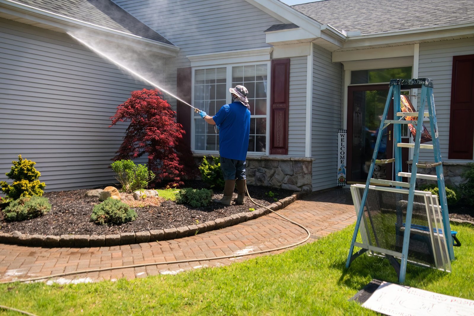 Before and after soft washing siding on a Beaverton home
