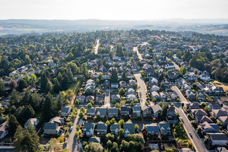 Roof cleaning in Tigard home with moss and debris removal by Suds Doctor